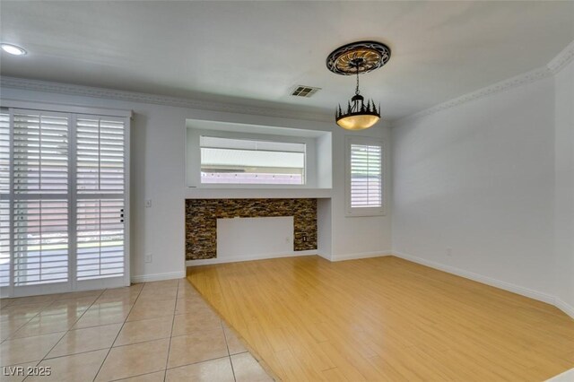 10513 Shanna Trellis Ave, Las Vegas, NV 89144 - unfurnished living room featuring a fireplace and light tile patterned flooring