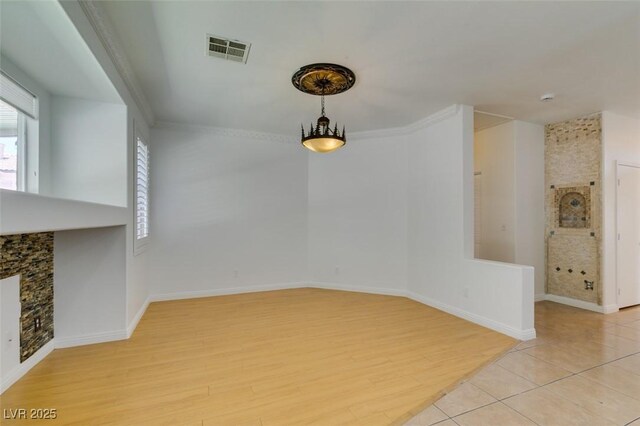 10513 Shanna Trellis Ave, Las Vegas, NV 89144 - unfurnished dining area featuring light wood-type flooring and a fireplace