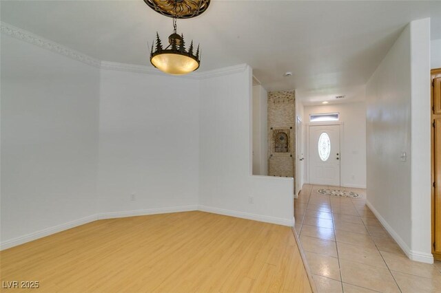 10513 Shanna Trellis Ave, Las Vegas, NV 89144 - foyer with baseboards and light wood-style floors