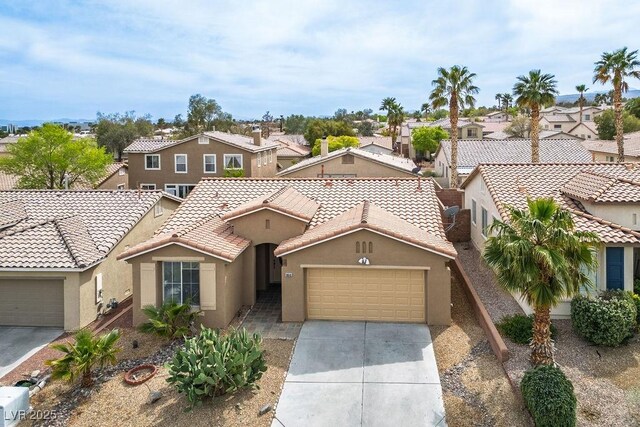 10513 Shanna Trellis Ave, Las Vegas, NV 89144 - mediterranean / spanish-style house with a residential view, a garage, concrete driveway, and stucco siding