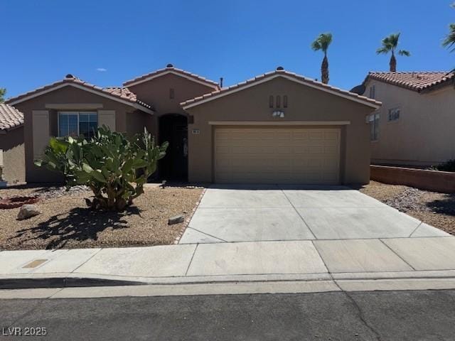 10513 Shanna Trellis Ave, Las Vegas, NV 89144 - view of front of property featuring an attached garage, stucco siding, concrete driveway, and a tile roof