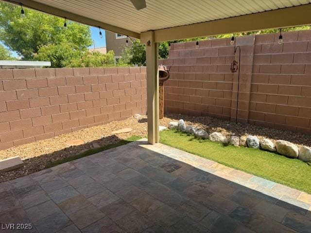 10513 Shanna Trellis Ave, Las Vegas, NV 89144 - fenced backyard with a patio