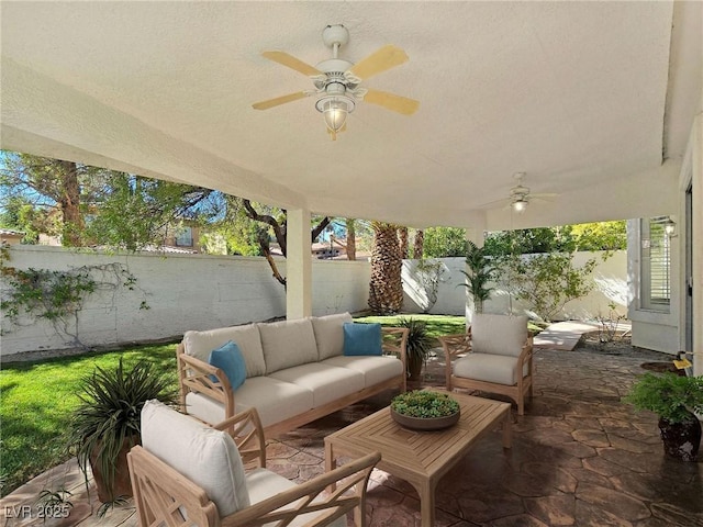 8981 Rivers Edge Dr, Las Vegas, NV 89117 - fenced backyard with ceiling fan, a patio area, and an outdoor hangout area