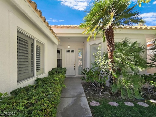 8981 Rivers Edge Dr, Las Vegas, NV 89117 - doorway to property with stucco siding and a tiled roof
