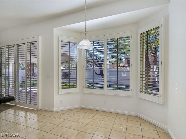 8981 Rivers Edge Dr, Las Vegas, NV 89117 - unfurnished dining area featuring tile patterned floors and baseboards