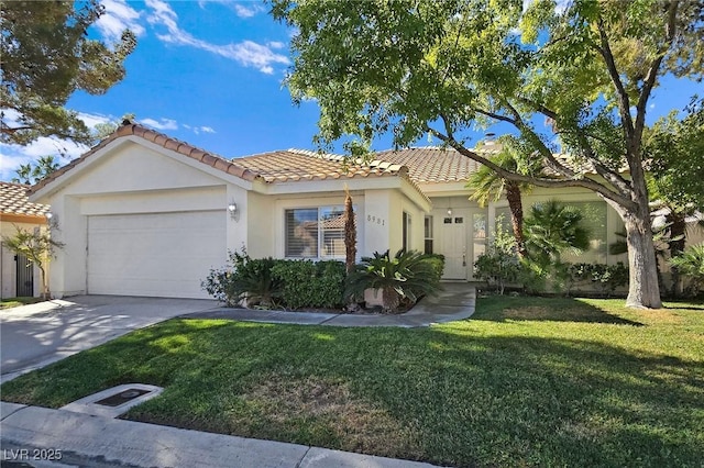 8981 Rivers Edge Dr, Las Vegas, NV 89117 - mediterranean / spanish-style house featuring a tile roof, an attached garage, stucco siding, concrete driveway, and a front lawn