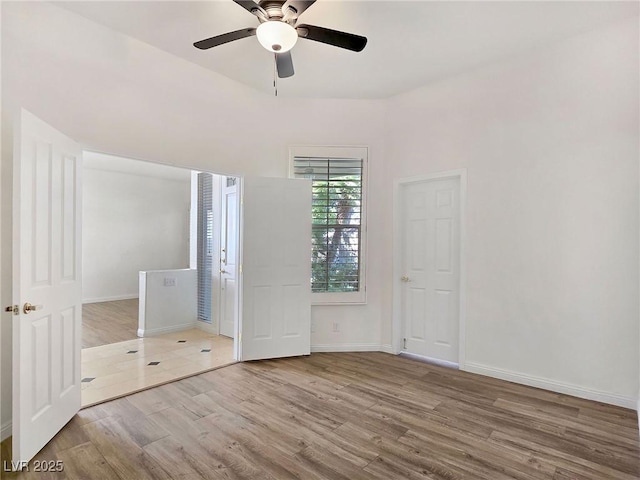 8981 Rivers Edge Dr, Las Vegas, NV 89117 - unfurnished bedroom with wood finished floors and ceiling fan