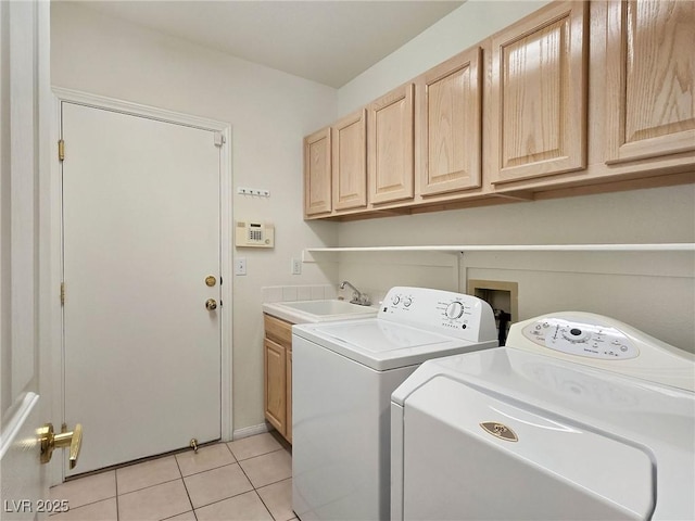 8981 Rivers Edge Dr, Las Vegas, NV 89117 - laundry room with washing machine and dryer, cabinet space, and light tile patterned flooring