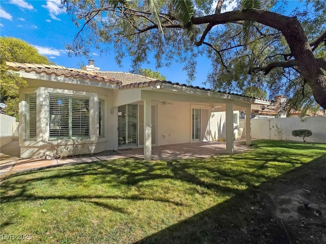 8981 Rivers Edge Dr, Las Vegas, NV 89117 - rear view of house with ceiling fan, stucco siding, a chimney, a tiled roof, and a patio