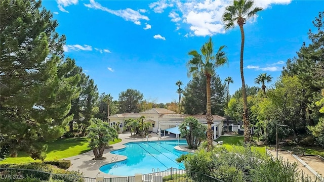 8981 Rivers Edge Dr, Las Vegas, NV 89117 - community pool with a patio area and view of wooded area