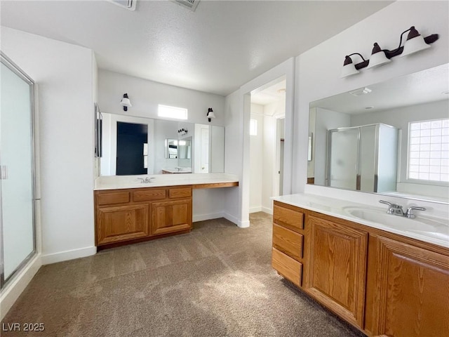 4126 Jessica Marie St, North Las Vegas, NV 89032 - bathroom featuring a shower stall, plenty of natural light, two vanities, and carpet