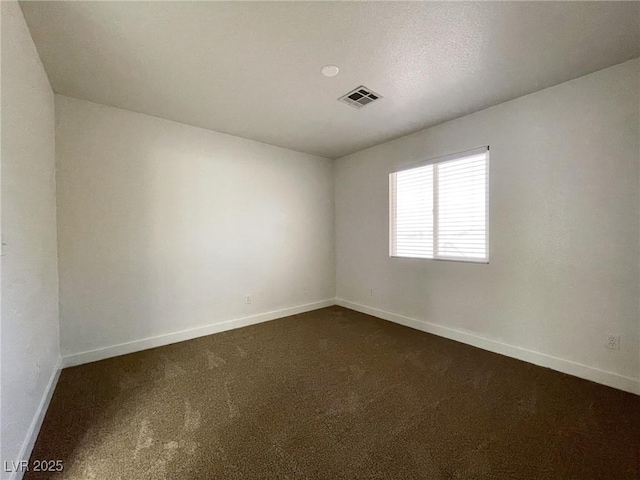 4126 Jessica Marie St, North Las Vegas, NV 89032 - spare room featuring baseboards and dark colored carpet