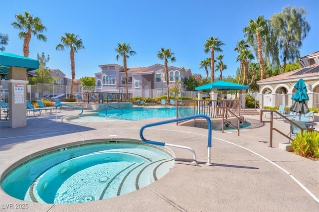 9975 Peace Way Unit 2009, Las Vegas, NV 89147 - community pool featuring a residential view, a community hot tub, and a patio