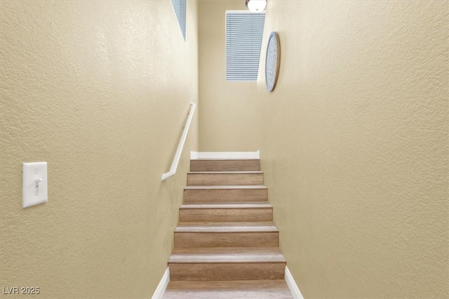 9975 Peace Way Unit 2009, Las Vegas, NV 89147 - staircase with a textured wall