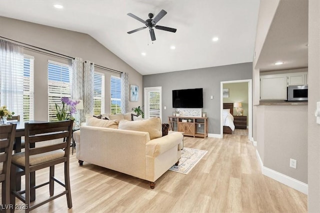 9975 Peace Way Unit 2009, Las Vegas, NV 89147 - living area featuring light wood-type flooring, a ceiling fan, vaulted ceiling, and recessed lighting