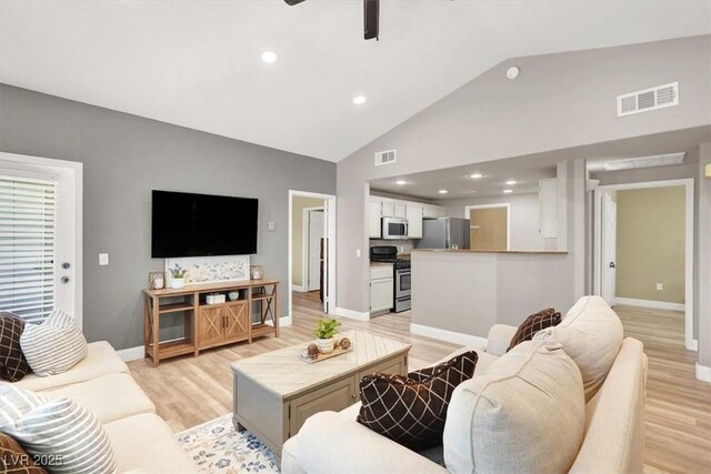 9975 Peace Way Unit 2009, Las Vegas, NV 89147 - living room featuring light wood-type flooring, ceiling fan, high vaulted ceiling, and recessed lighting
