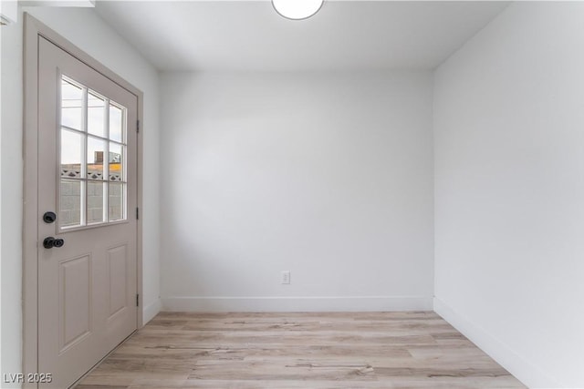 1808 E Saint Louis Ave, Las Vegas, NV 89104 - doorway featuring light wood-style floors and baseboards
