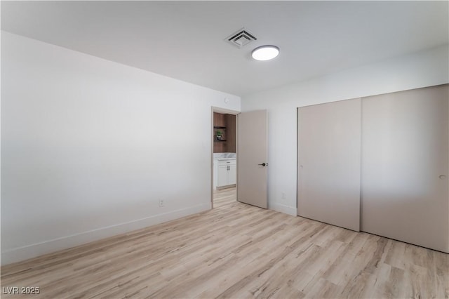 1808 E Saint Louis Ave, Las Vegas, NV 89104 - unfurnished bedroom featuring light wood-type flooring and a closet