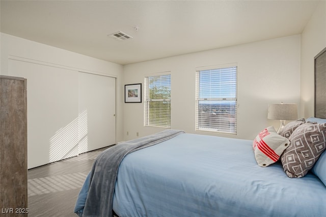2068 Mesquite Ln Unit 203, Laughlin, NV 89029 - bedroom with wood finished floors and a closet