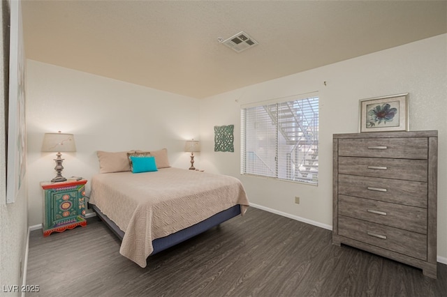 2068 Mesquite Ln Unit 203, Laughlin, NV 89029 - bedroom with dark wood finished floors and baseboards