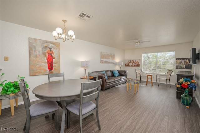 2068 Mesquite Ln Unit 203, Laughlin, NV 89029 - dining room featuring wood finished floors, a chandelier, and a ceiling fan