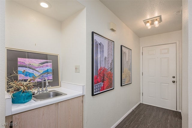 2068 Mesquite Ln Unit 203, Laughlin, NV 89029 - bar with a sink and dark wood-style flooring