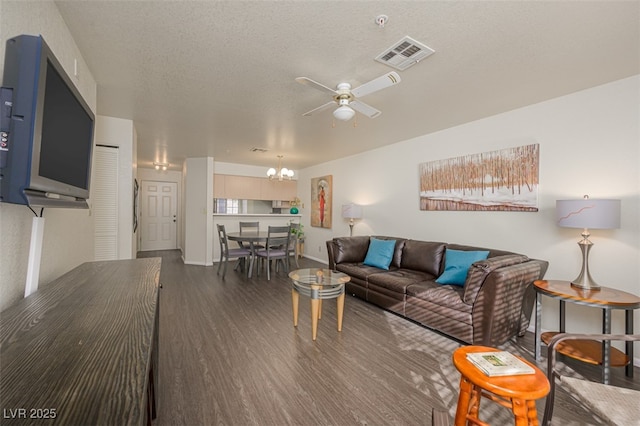 2068 Mesquite Ln Unit 203, Laughlin, NV 89029 - living area featuring wood finished floors, ceiling fan, and a chandelier