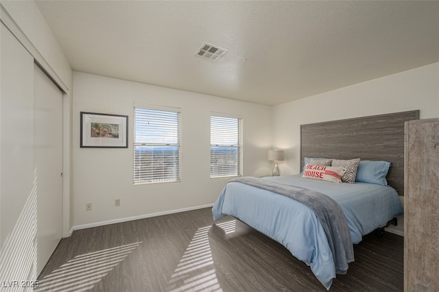 2068 Mesquite Ln Unit 203, Laughlin, NV 89029 - bedroom with wood finished floors and a closet