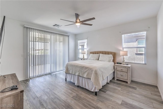 3821 Nesting Wren Dr, North Las Vegas, NV 89084 - bedroom with light wood-type flooring, access to exterior, and a ceiling fan