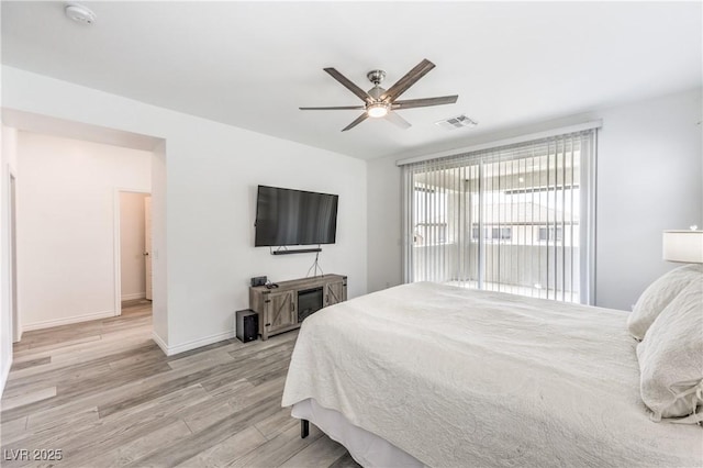 3821 Nesting Wren Dr, North Las Vegas, NV 89084 - bedroom with light wood-style floors and a ceiling fan