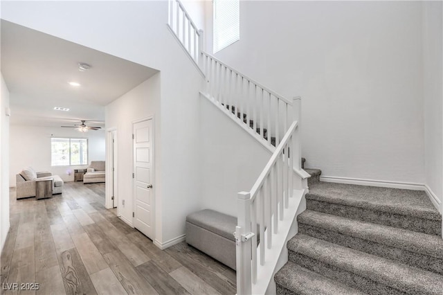 3821 Nesting Wren Dr, North Las Vegas, NV 89084 - stairway featuring ceiling fan and wood finished floors