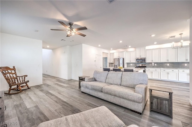3821 Nesting Wren Dr, North Las Vegas, NV 89084 - living room featuring a ceiling fan, light wood-style flooring, and recessed lighting