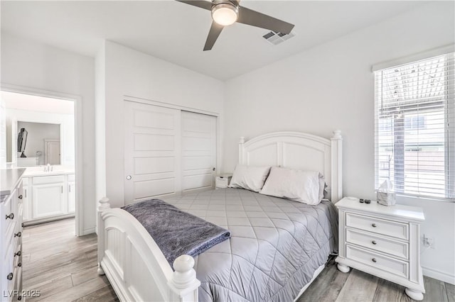 3821 Nesting Wren Dr, North Las Vegas, NV 89084 - bedroom featuring a closet, light wood-style floors, and a ceiling fan