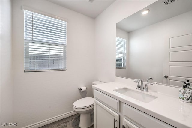 3821 Nesting Wren Dr, North Las Vegas, NV 89084 - half bathroom with wood finished floors and vanity