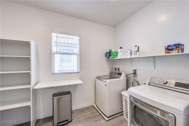 3821 Nesting Wren Dr, North Las Vegas, NV 89084 - laundry room with separate washer and dryer and light wood-type flooring