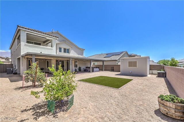 3821 Nesting Wren Dr, North Las Vegas, NV 89084 - rear view of house with a patio area, a fenced backyard, and stucco siding