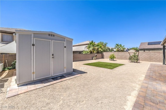3821 Nesting Wren Dr, North Las Vegas, NV 89084 - fenced backyard with a storage shed and a patio