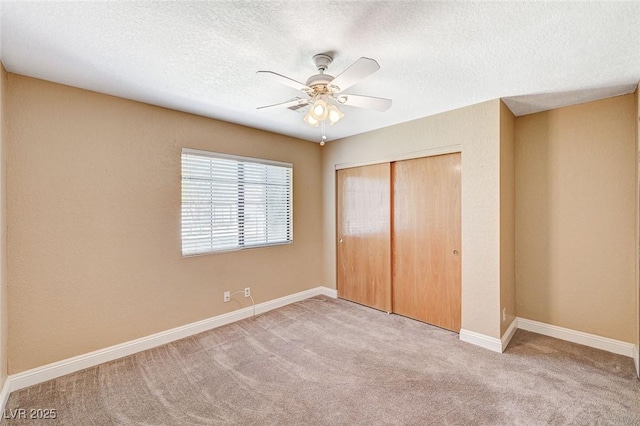 5401 Broadwater Ln, Las Vegas, NV 89130 - unfurnished bedroom featuring a closet, carpet floors, a textured ceiling, and a ceiling fan