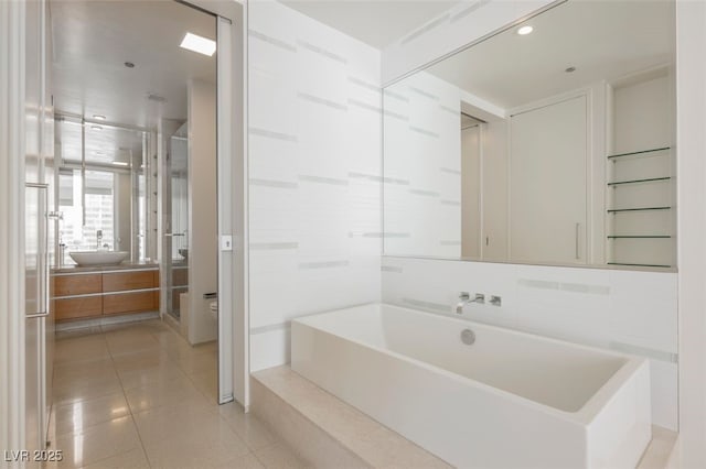 3726 Las Vegas Blvd Unit 704, Las Vegas, NV 89158 - full bath featuring vanity, a garden tub, tile patterned floors, and recessed lighting