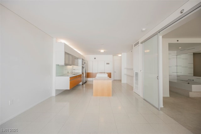 3726 Las Vegas Blvd Unit 704, Las Vegas, NV 89158 - kitchen with light countertops, a center island, white cabinetry, and modern cabinets