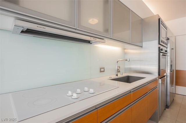 3726 Las Vegas Blvd Unit 704, Las Vegas, NV 89158 - kitchen with stainless steel appliances, extractor fan, light countertops, and light tile patterned floors