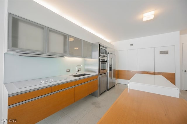 3726 Las Vegas Blvd Unit 704, Las Vegas, NV 89158 - kitchen with appliances with stainless steel finishes, light countertops, glass insert cabinets, and modern cabinets