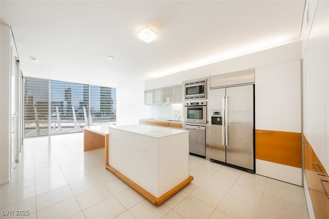 3726 Las Vegas Blvd Unit 704, Las Vegas, NV 89158 - kitchen with built in appliances, a center island, and light countertops