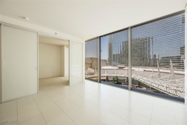 3726 Las Vegas Blvd Unit 704, Las Vegas, NV 89158 - spare room with expansive windows and a smoke detector