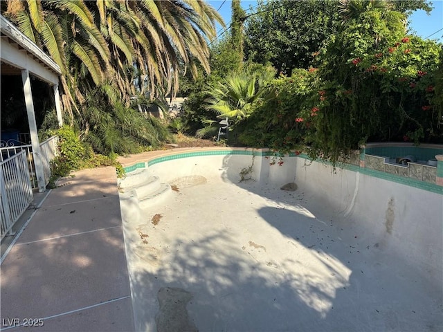 4928 E Philadelphia Ave, Las Vegas, NV 89104 - view of swimming pool featuring a patio and an empty pool