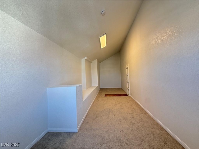 3606 Di Salvo Dr Unit 133, Las Vegas, NV 89103 - hallway with vaulted ceiling, carpet flooring, and an upstairs landing