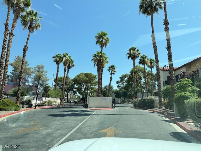 3606 Di Salvo Dr Unit 133, Las Vegas, NV 89103 - view of asphalt road with curbs and a gated entry