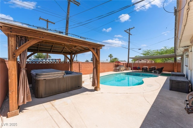 704 N Wallace Dr, Las Vegas, NV 89107 - view of swimming pool with a hot tub, a gazebo, a patio, and a fenced backyard