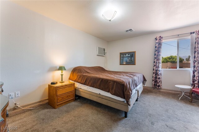 704 N Wallace Dr, Las Vegas, NV 89107 - bedroom featuring carpet floors and an AC wall unit