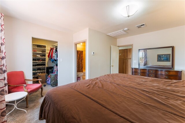 704 N Wallace Dr, Las Vegas, NV 89107 - bedroom with carpet floors, a spacious closet, and a closet